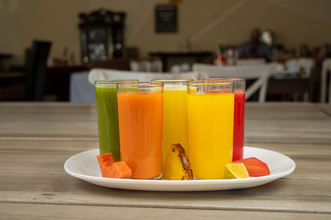 Colorful fruit juices on a wooden table in a Mexican restaurant in Salamanca, Mexico.
